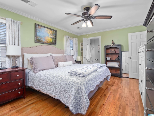 bedroom with ceiling fan, light hardwood / wood-style flooring, ornamental molding, and multiple windows