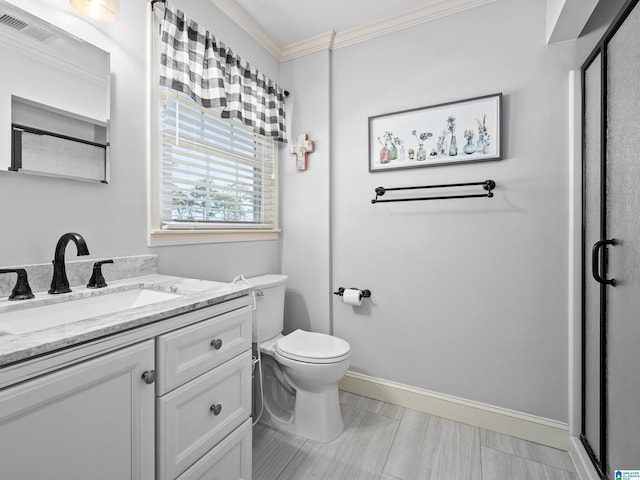 bathroom featuring toilet, vanity, and ornamental molding