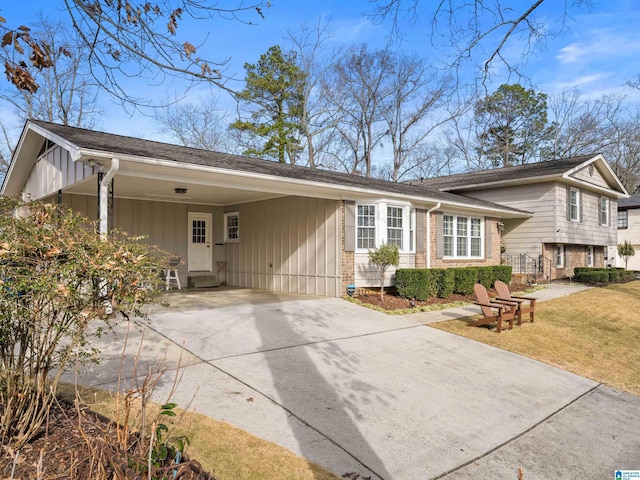 view of property exterior with a carport and a lawn