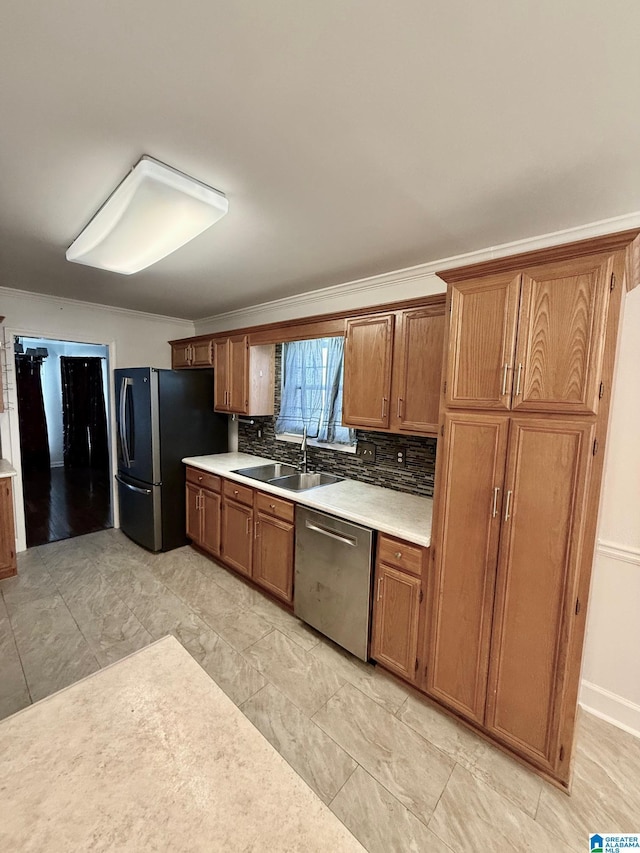 kitchen featuring decorative backsplash, stainless steel appliances, and sink