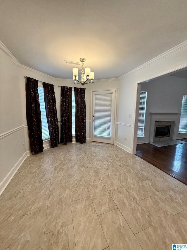 unfurnished dining area featuring a chandelier and ornamental molding