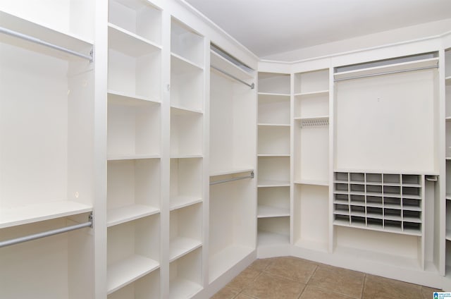 spacious closet featuring tile patterned floors