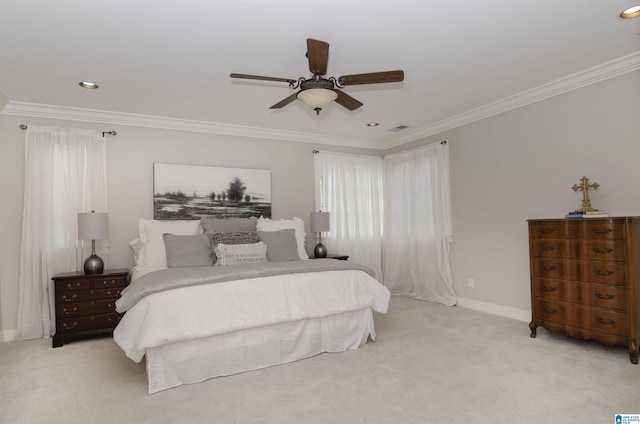 carpeted bedroom featuring crown molding and ceiling fan