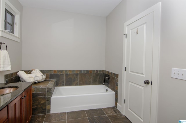 bathroom featuring vanity and a bathing tub