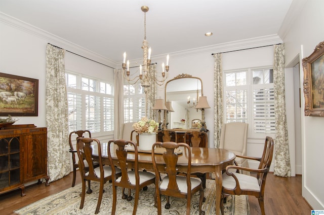 dining space with a notable chandelier, plenty of natural light, and dark hardwood / wood-style floors