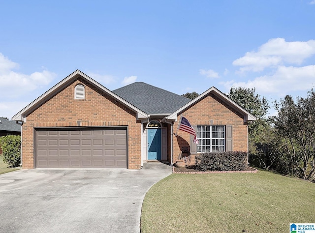 view of front facade with a garage and a front lawn