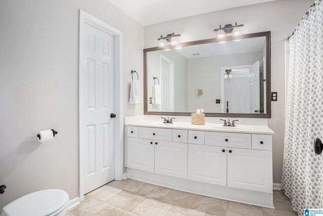 bathroom with ceiling fan, tile patterned floors, vanity, and toilet