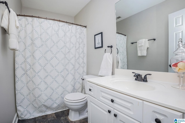 bathroom with toilet and vanity