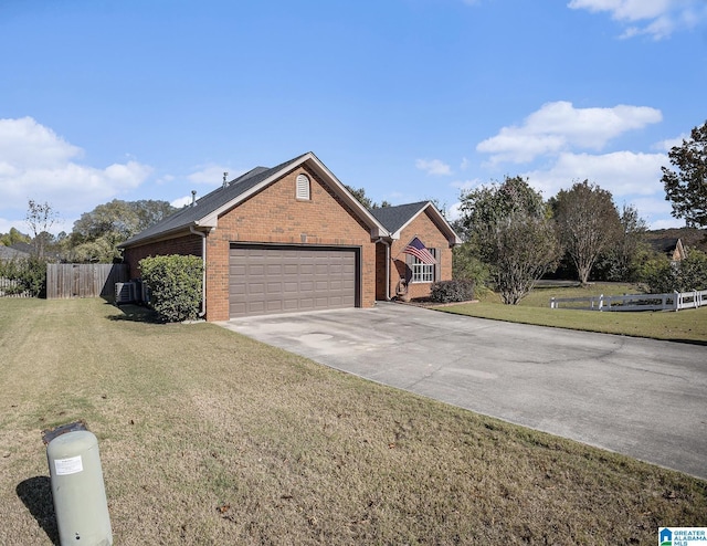 view of front of house featuring a front yard and a garage