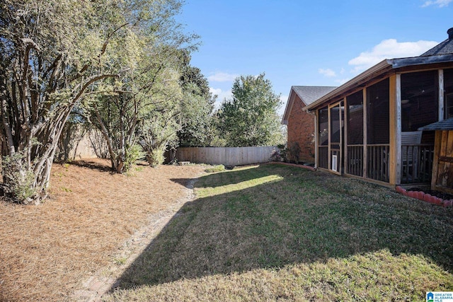 view of yard with a sunroom