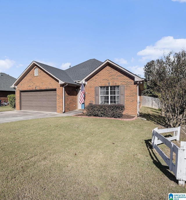 view of front of home with a garage and a front yard