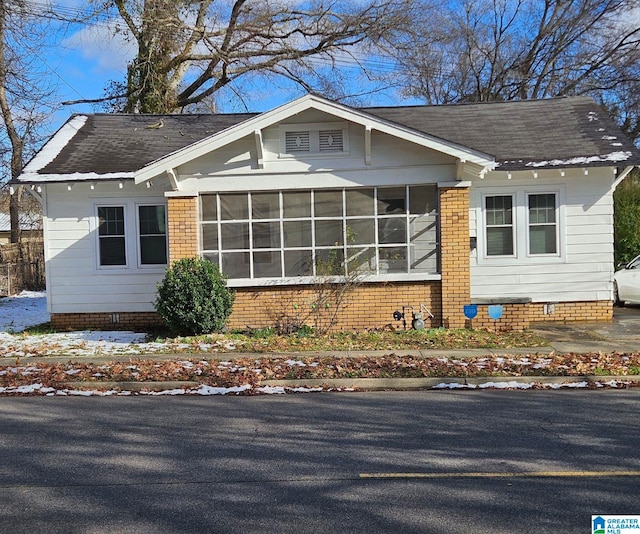 view of front of property with a sunroom