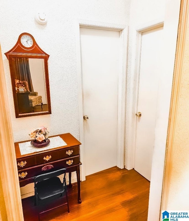 hallway with wood-type flooring