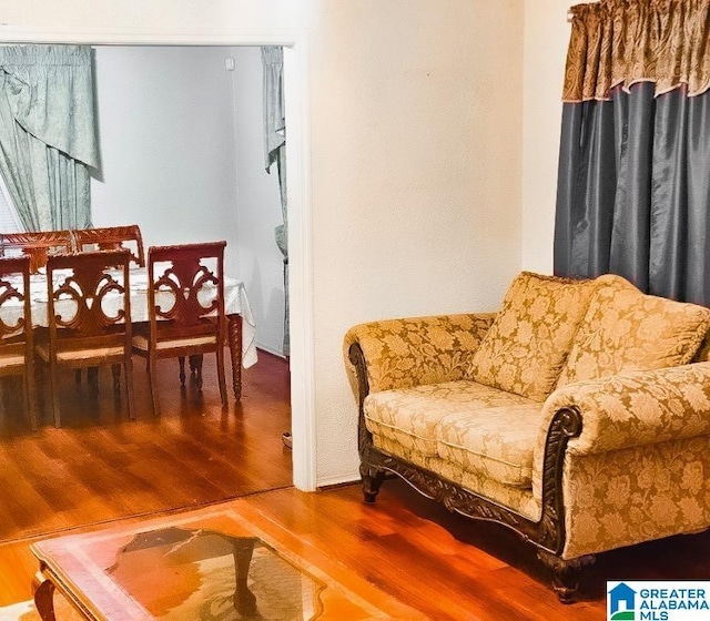 sitting room with hardwood / wood-style flooring