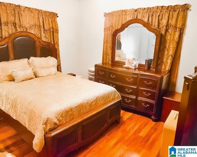 bedroom featuring wood-type flooring