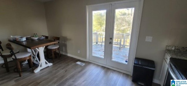 dining area featuring french doors and hardwood / wood-style floors