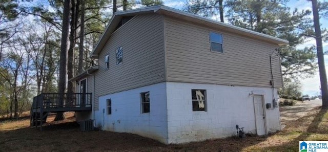 view of side of home featuring a deck