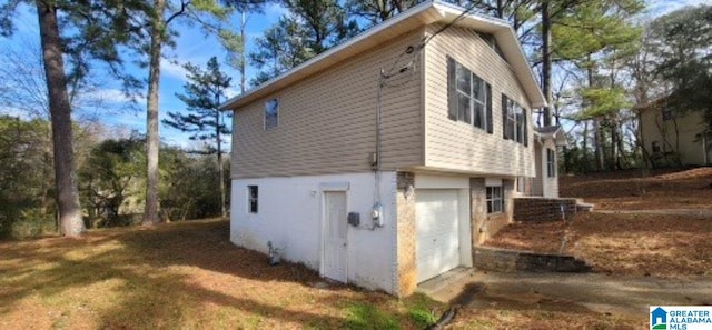 view of side of property featuring a garage