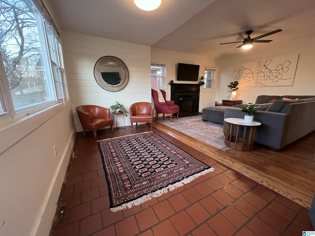 interior space with ceiling fan