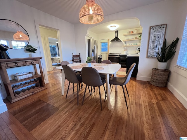 dining room with hardwood / wood-style flooring