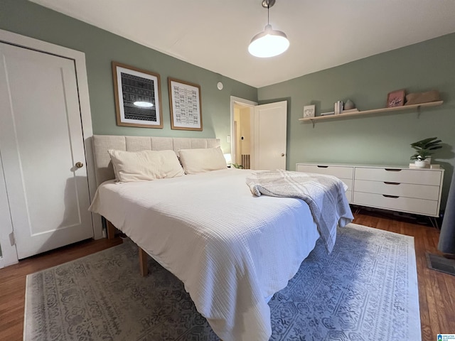 bedroom featuring dark hardwood / wood-style flooring