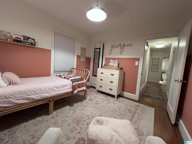 bedroom featuring wood-type flooring