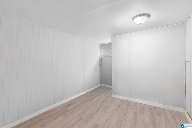 spacious closet with light hardwood / wood-style flooring