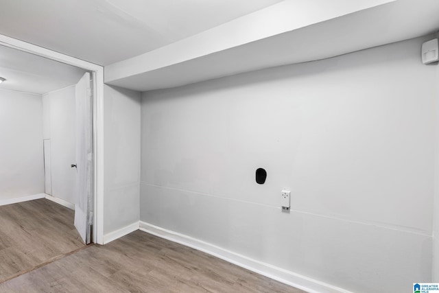 washroom with hardwood / wood-style floors