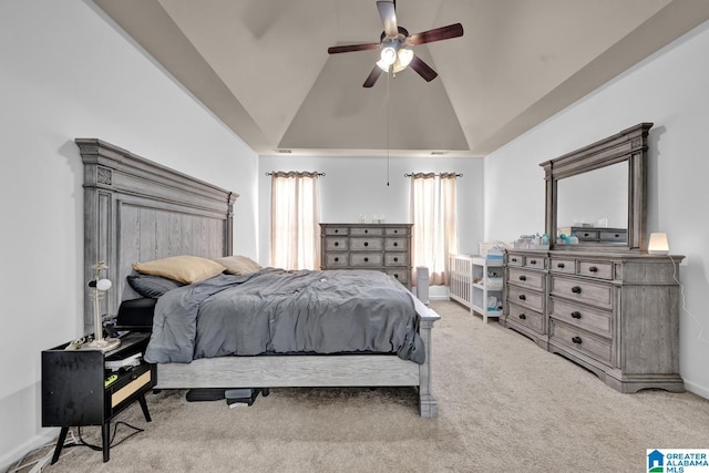 carpeted bedroom with ceiling fan and lofted ceiling