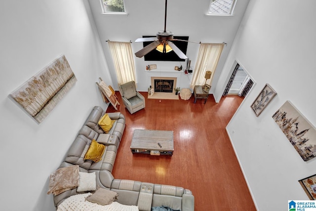 living room with hardwood / wood-style floors and ceiling fan