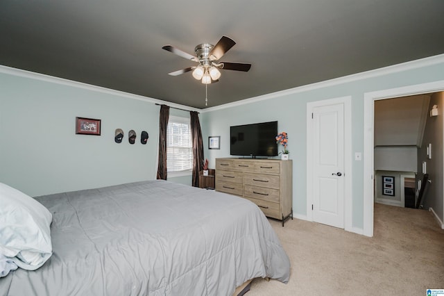 bedroom with ceiling fan, crown molding, and light carpet