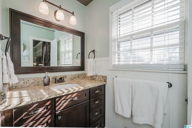 bathroom featuring plenty of natural light and vanity