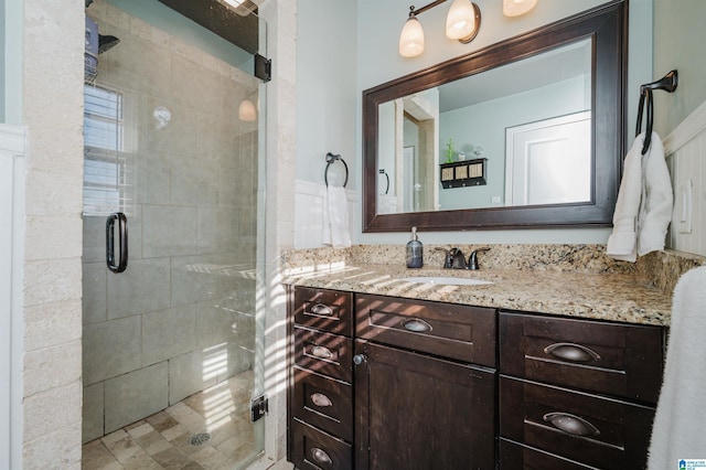 bathroom with an enclosed shower and vanity