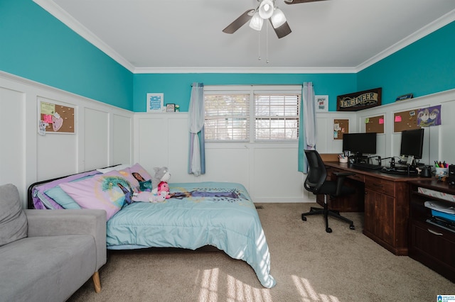 bedroom with light carpet, ceiling fan, and crown molding