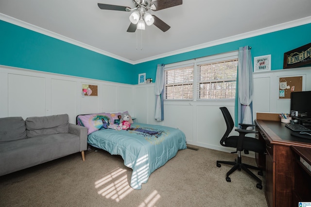 bedroom featuring ceiling fan, ornamental molding, and light carpet