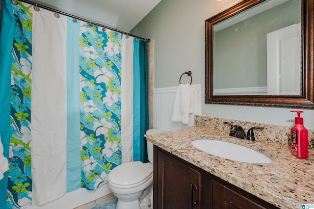 full bathroom with toilet, tile patterned flooring, shower / tub combo with curtain, and vanity