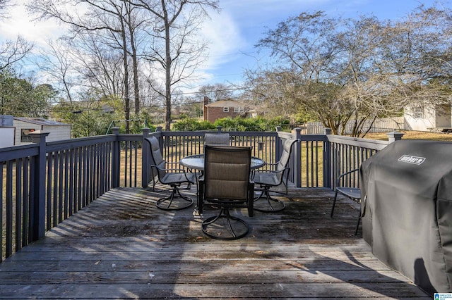 wooden deck featuring area for grilling