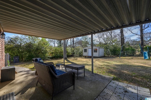 view of patio / terrace with a playground and a shed