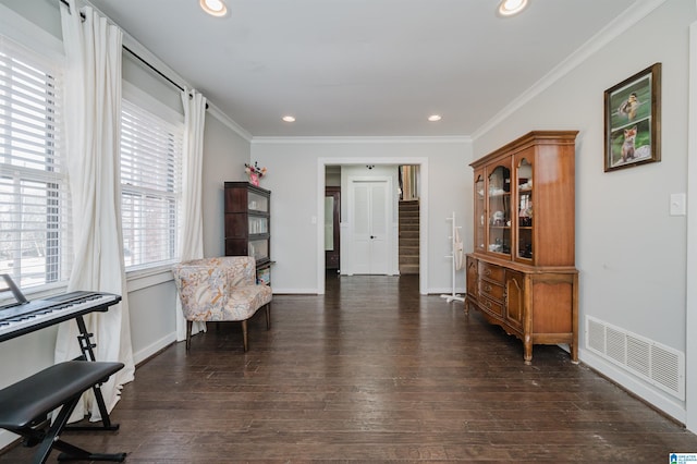 sitting room featuring dark hardwood / wood-style flooring and ornamental molding