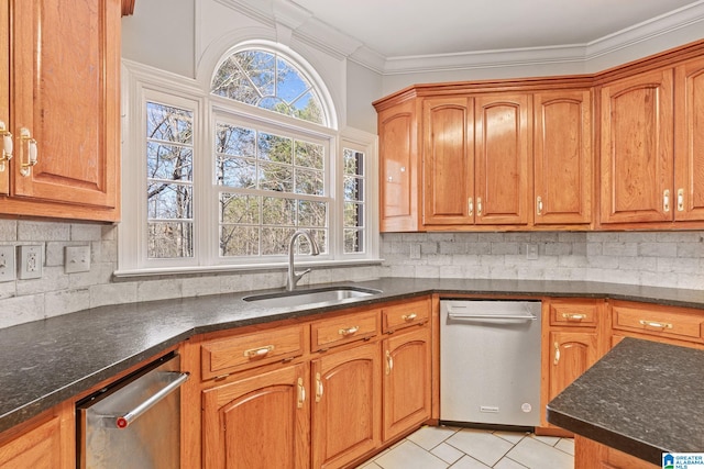 kitchen with decorative backsplash, sink, dark stone countertops, dishwasher, and light tile patterned flooring