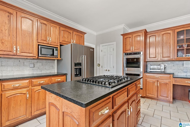 kitchen with backsplash, stainless steel appliances, crown molding, light tile patterned floors, and a kitchen island