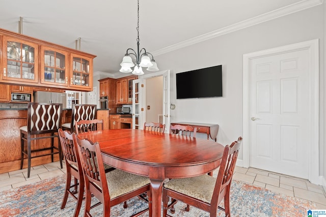 tiled dining room with ornamental molding and a chandelier