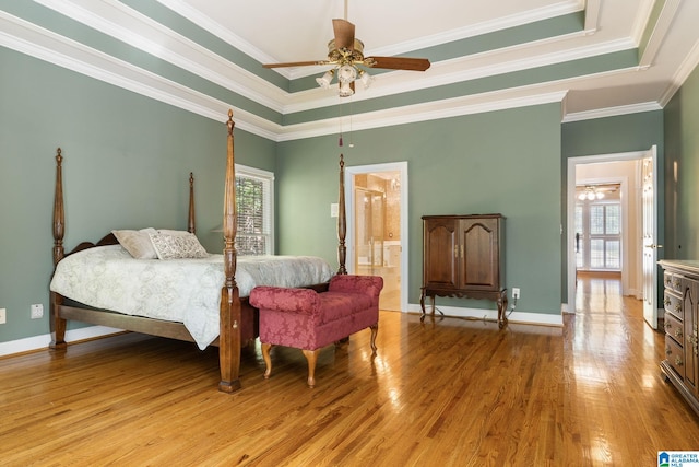 bedroom featuring connected bathroom, ceiling fan, and ornamental molding