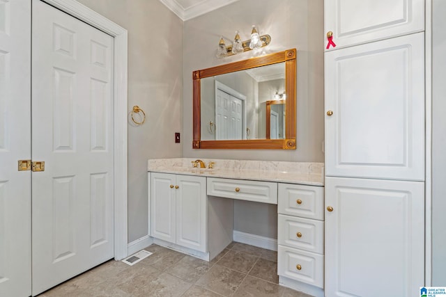 bathroom with vanity and crown molding