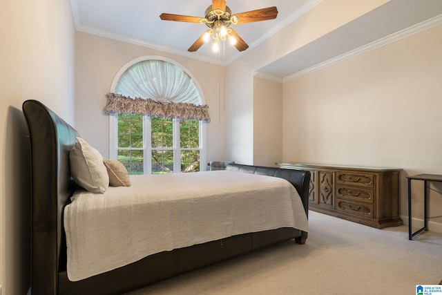 carpeted bedroom with ceiling fan and crown molding