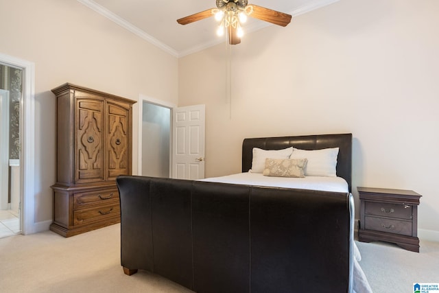 carpeted bedroom with ceiling fan and ornamental molding