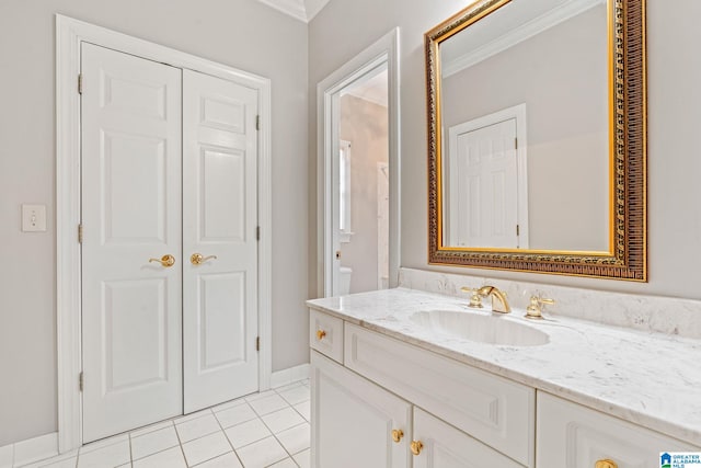 bathroom with vanity, tile patterned floors, and ornamental molding