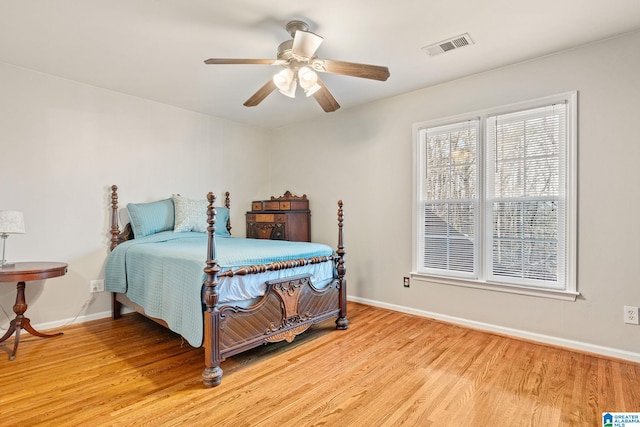 bedroom featuring ceiling fan and light hardwood / wood-style flooring