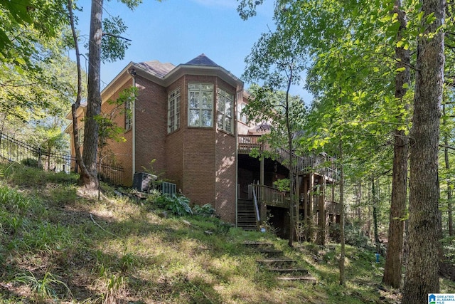 view of side of property featuring a deck