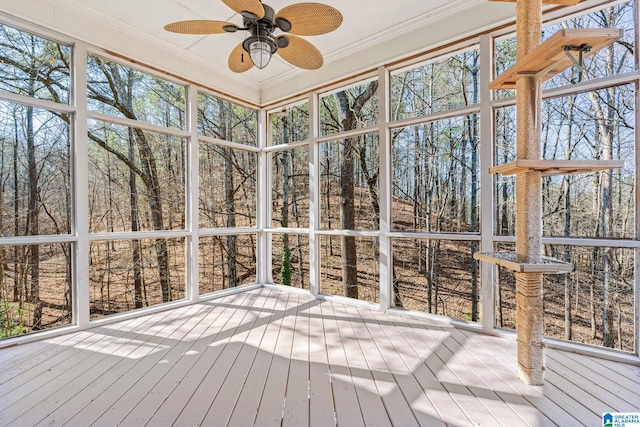 unfurnished sunroom featuring ceiling fan